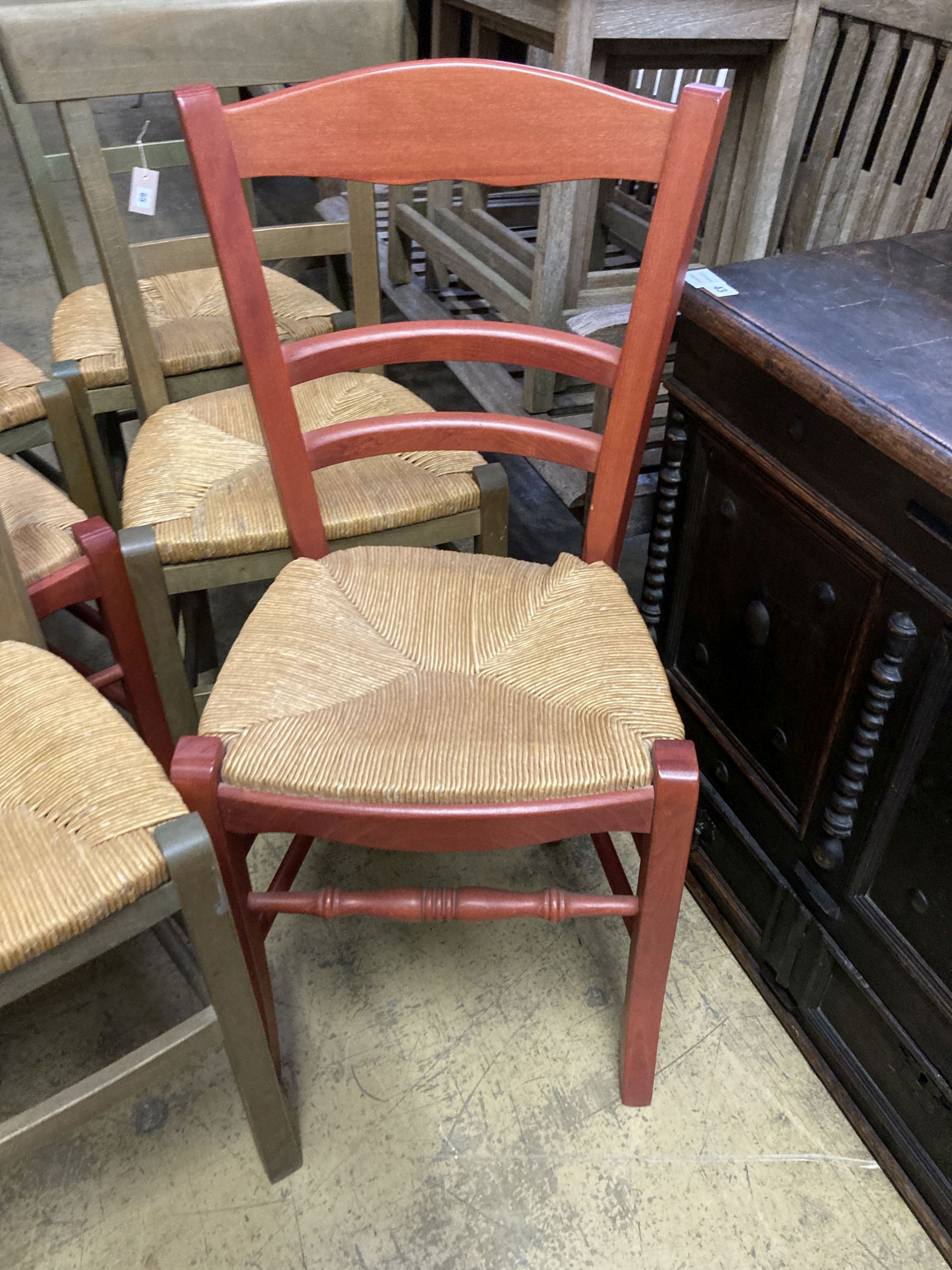 Six (four plus two) French stained beech rush seated dining chairs